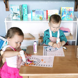 Cousins Working on Spanish Animal Alphabet Do-a-Dot Pages _ Living Montessori Now